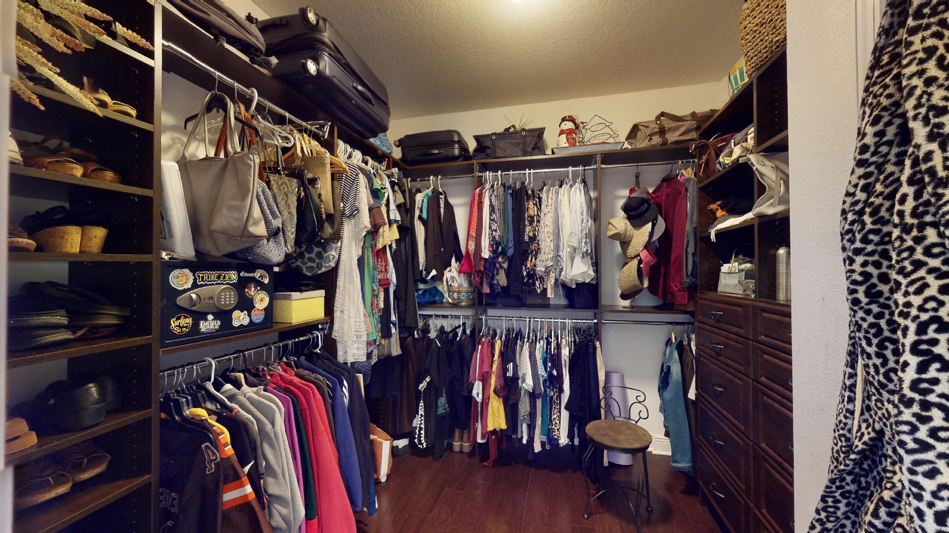 1959 Commodore Drive Navarre, FL 32566 - Photo 30 of 56 a view of walk in closet with clothes and shoes