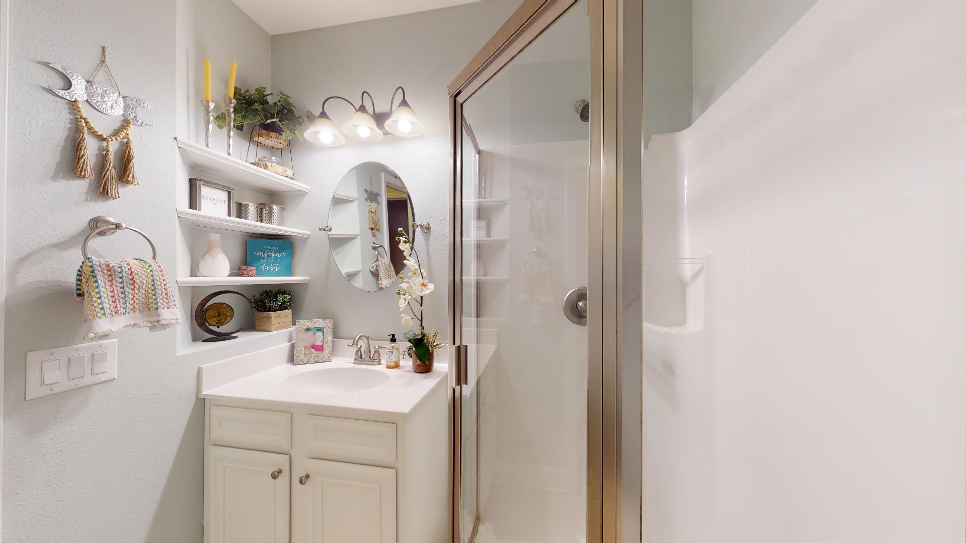 1959 Commodore Drive Navarre, FL 32566 - Photo 42 of 56 a bathroom with a sink and a mirror