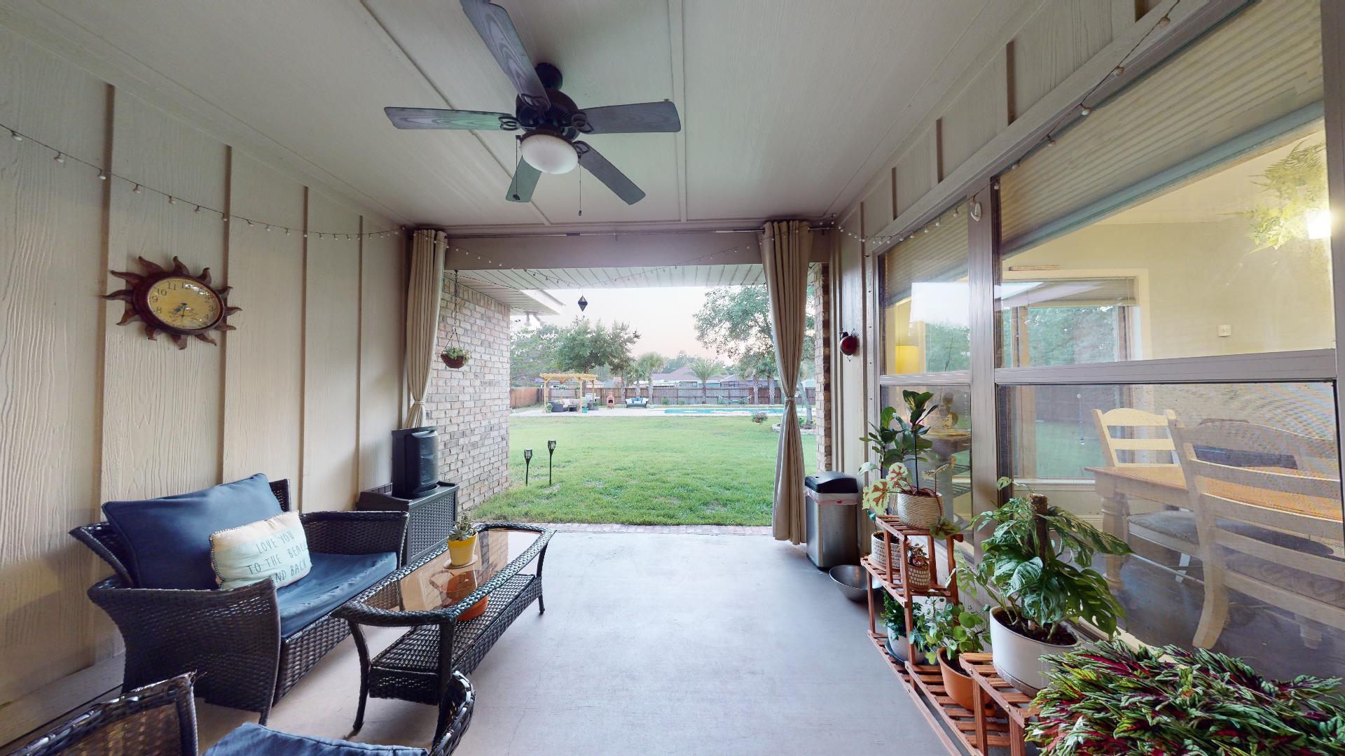 1959 Commodore Drive Navarre, FL 32566 - Photo 44 of 56 a living room filled with furniture