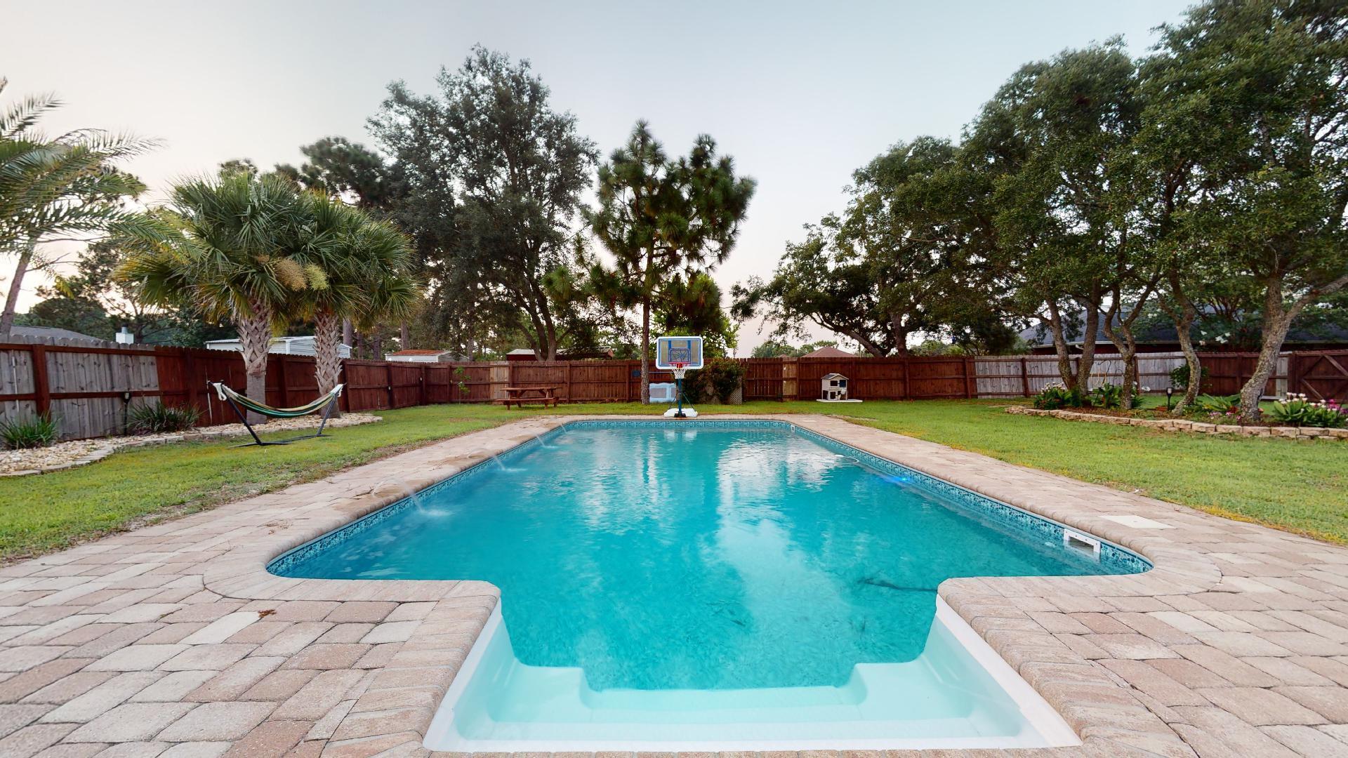 1959 Commodore Drive Navarre, FL 32566 - Photo 47 of 56 a view of a swimming pool with a yard