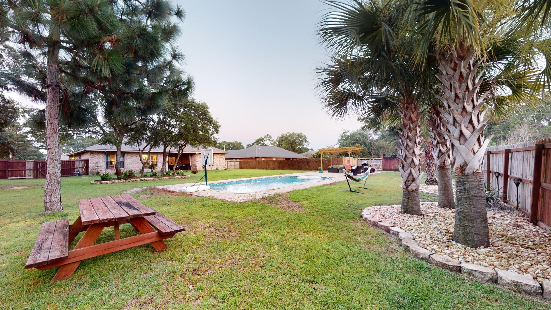 1959 Commodore Drive Navarre, FL 32566 - Photo 49 of 56 a view of a park with large trees