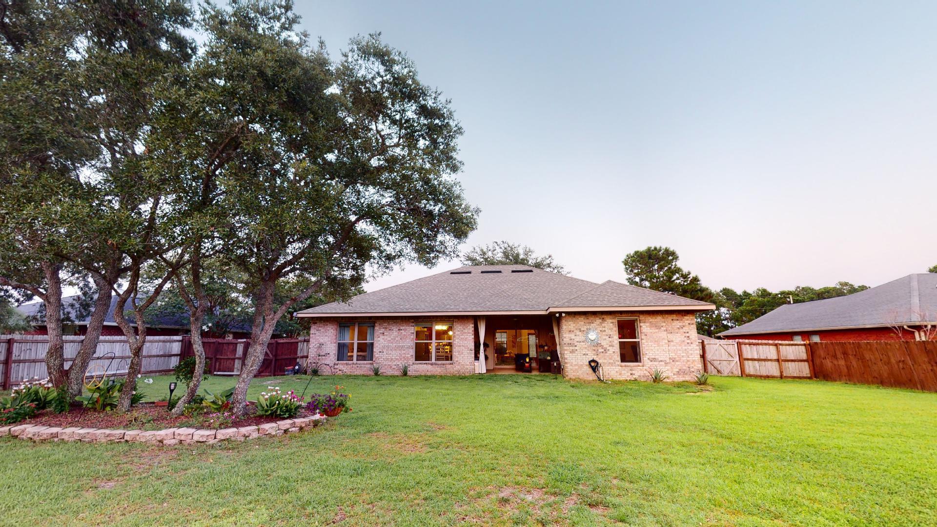 1959 Commodore Drive Navarre, FL 32566 - Photo 53 of 56 front view of a house with a yard