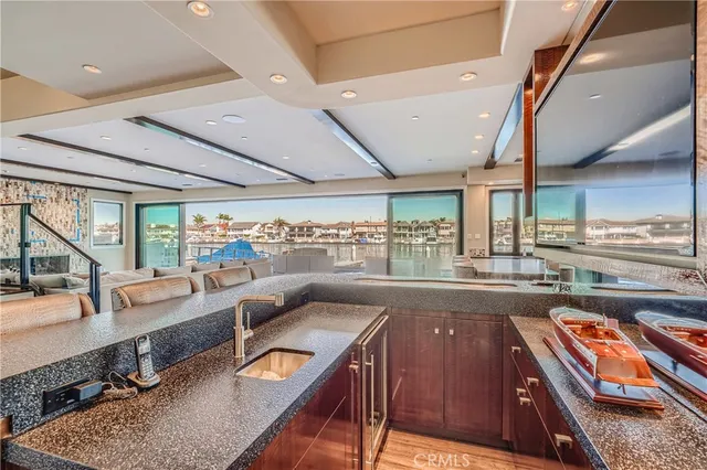 a view of staircase with wooden floor and a floor to ceiling window