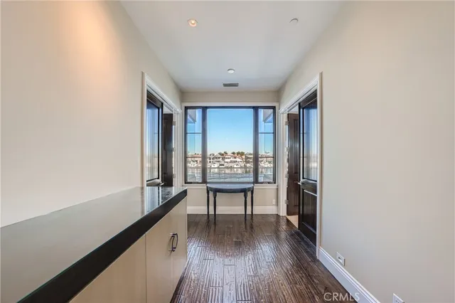 a large kitchen with a table and chairs in it