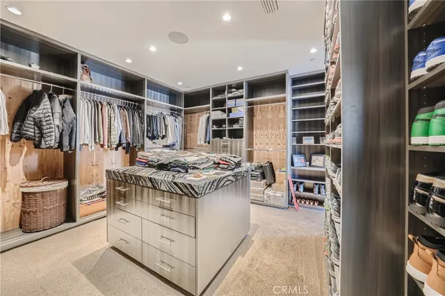 a bathroom with double vanity sink and a mirror