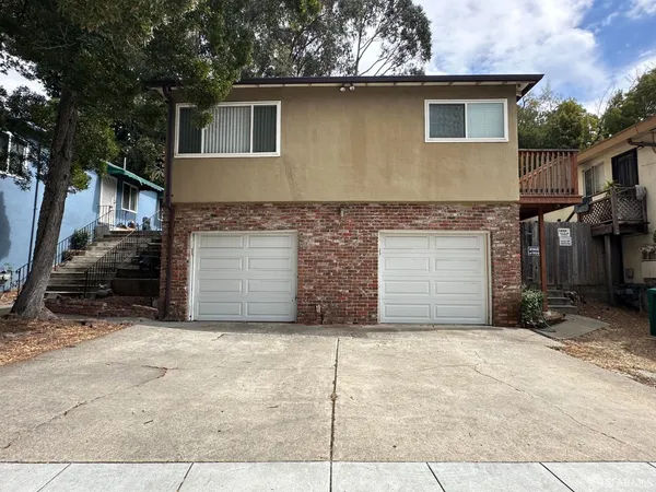 a front view of a house with a garage