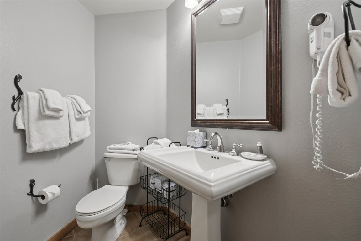 224 Trailhead Drive, Unit 3074 Keystone, CO 80435 - Photo 21 of 49 a bathroom with a toilet sink and mirror
