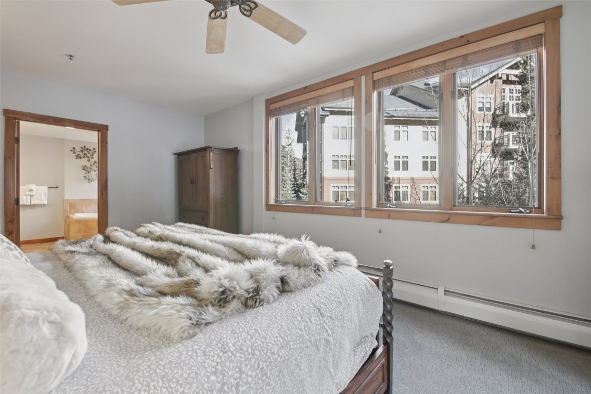 224 Trailhead Drive, Unit 3074 Keystone, CO 80435 - Photo 27 of 49 a bedroom with a bed and a window