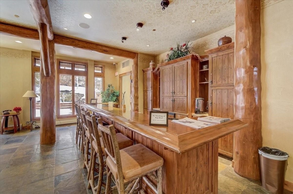 224 Trailhead Drive, Unit 3074 Keystone, CO 80435 - Photo 4 of 49 a dining hall with stainless steel appliances kitchen island granite countertop a table and chairs