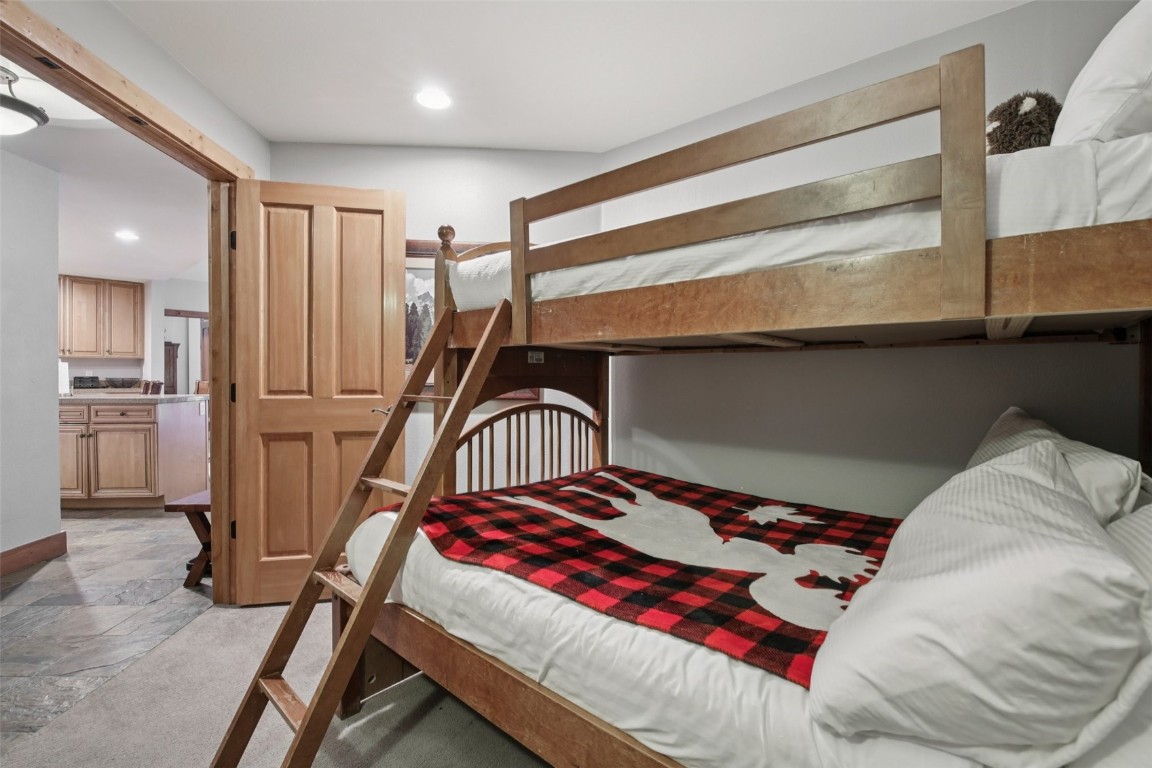 224 Trailhead Drive, Unit 3074 Keystone, CO 80435 - Photo 42 of 49 a bedroom with a bed and a walk in closet