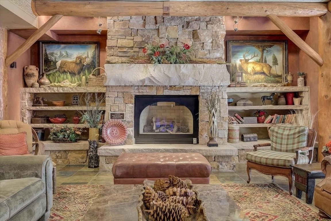 224 Trailhead Drive, Unit 3074 Keystone, CO 80435 - Photo 5 of 49 a living room with furniture and a fireplace