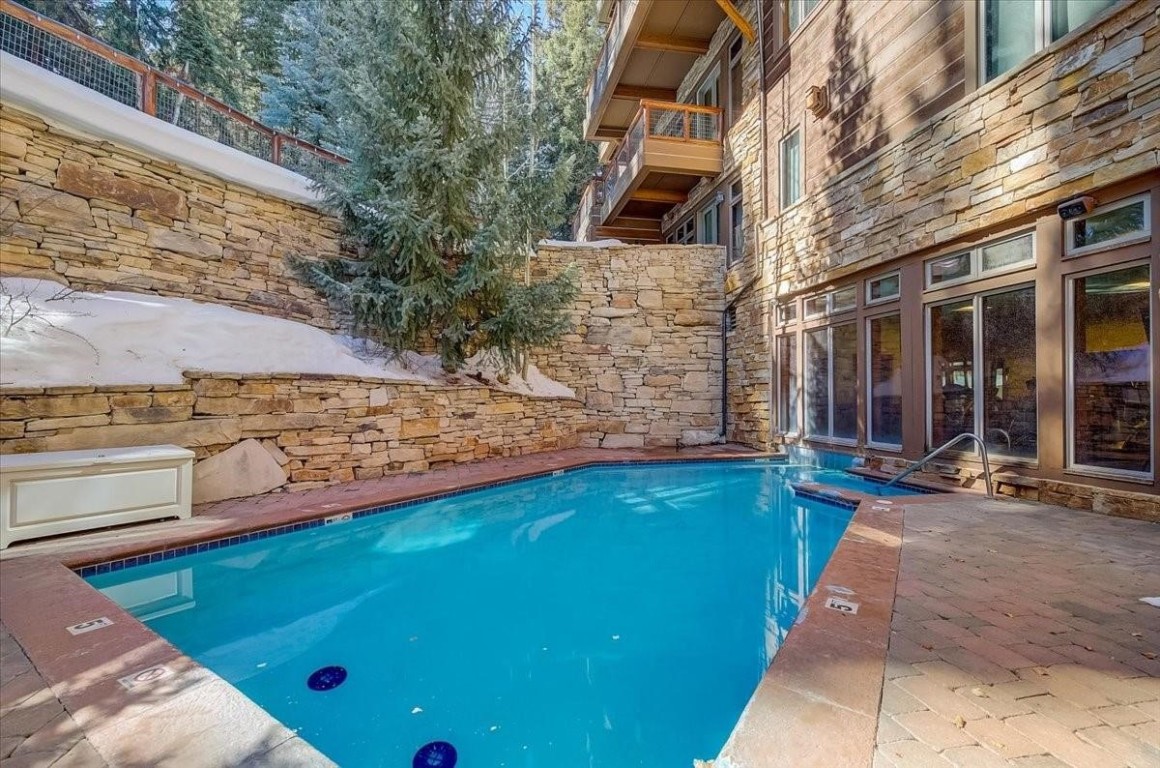 224 Trailhead Drive, Unit 3074 Keystone, CO 80435 - Photo 9 of 49 a view of a backyard with chairs and a small yard