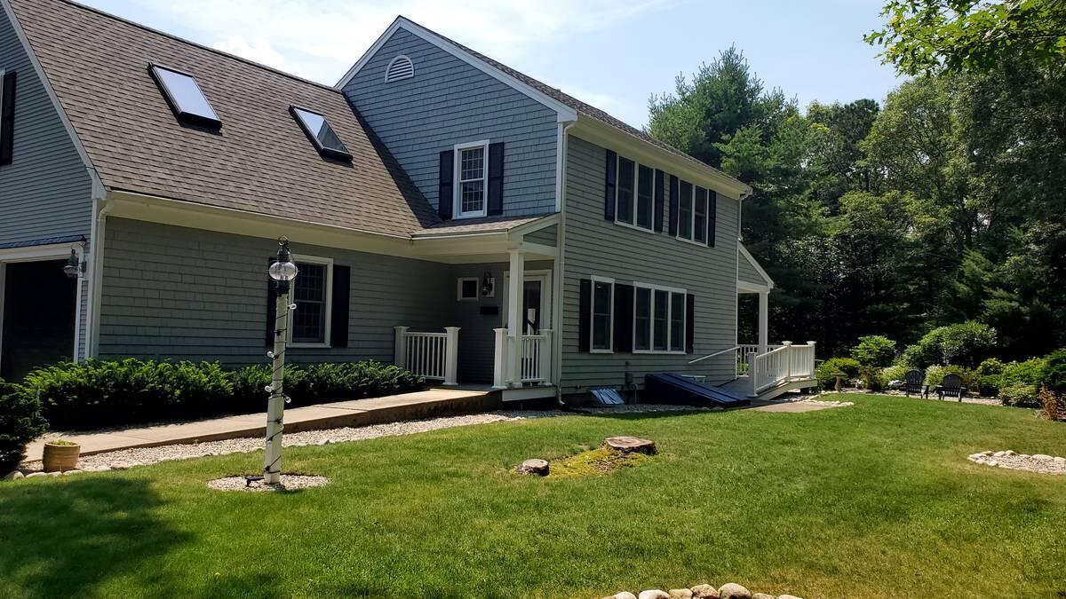 a house that has a big yard in front of it