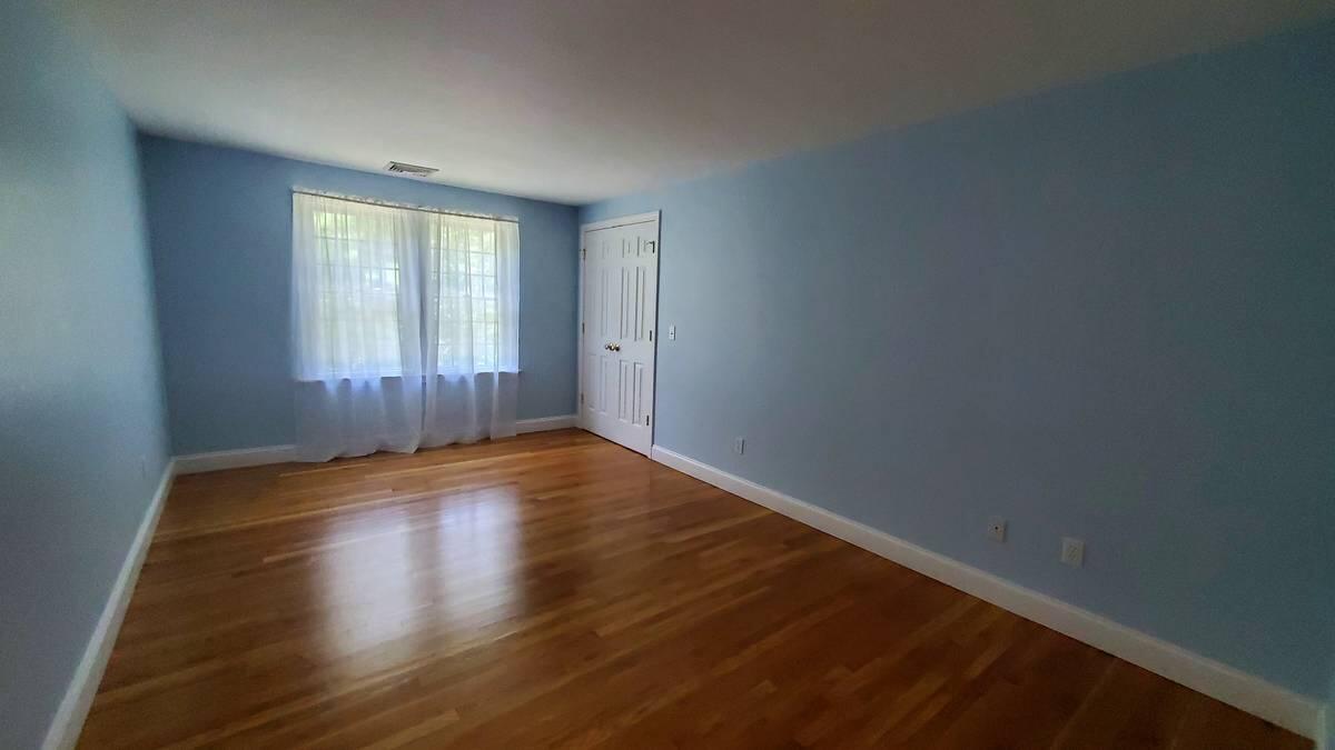 3 Kalmia Path Sandwich, MA 02563 - Photo 14 of 22 a view of wooden floor and windows in a room