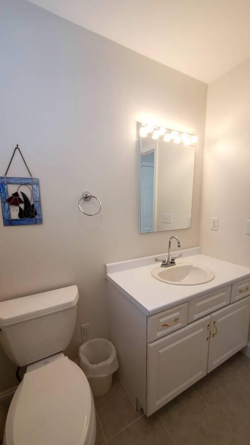 3 Kalmia Path Sandwich, MA 02563 - Photo 16 of 22 a bathroom with a toilet sink and mirror