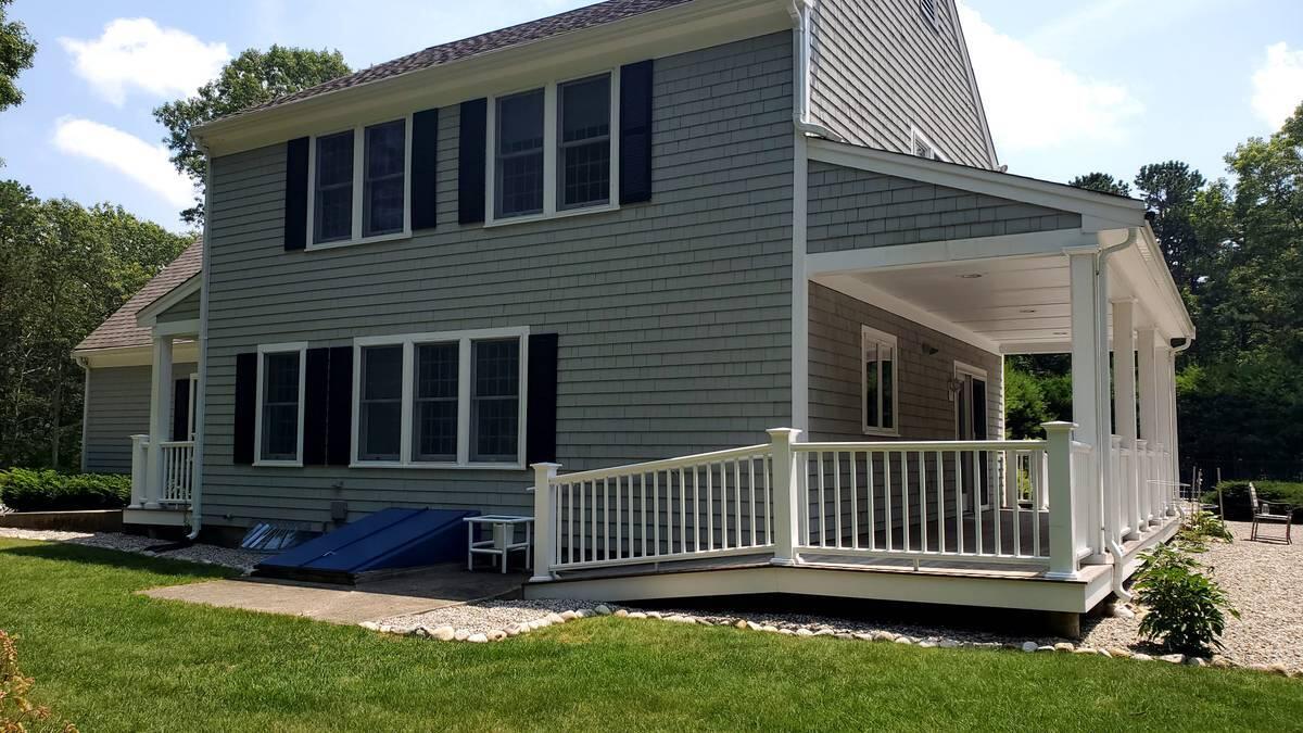 3 Kalmia Path Sandwich, MA 02563 - Photo 18 of 22 a view of a house with a yard and deck