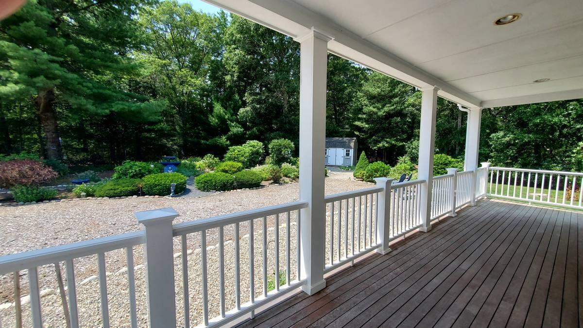 3 Kalmia Path Sandwich, MA 02563 - Photo 20 of 22 a view of a wooden deck next to a yard