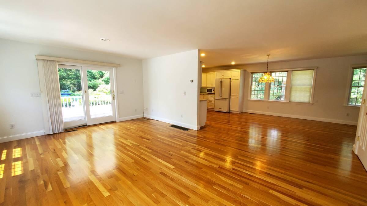 3 Kalmia Path Sandwich, MA 02563 - Photo 4 of 22 a view of an empty room with wooden floor and a window