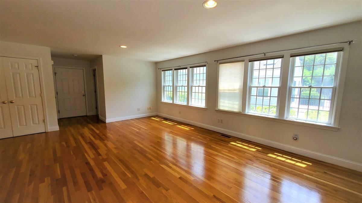 3 Kalmia Path Sandwich, MA 02563 - Photo 5 of 22 a view of an empty room with wooden floor and a window