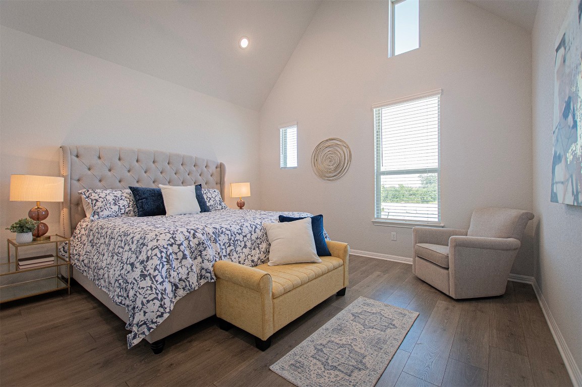 249 Treadwell Lane Kyle, TX 78640 - Photo 18 of 32 a bedroom with a large bed and a couch