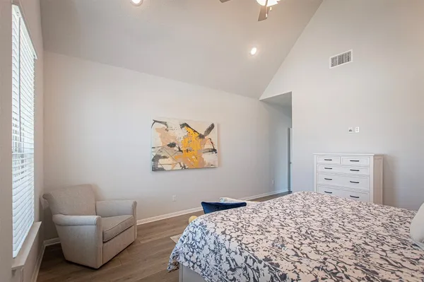 a bedroom with a bed and dresser