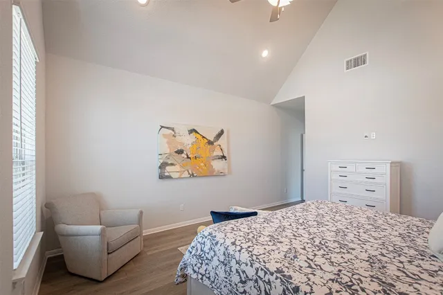 a bedroom with a bed and dresser