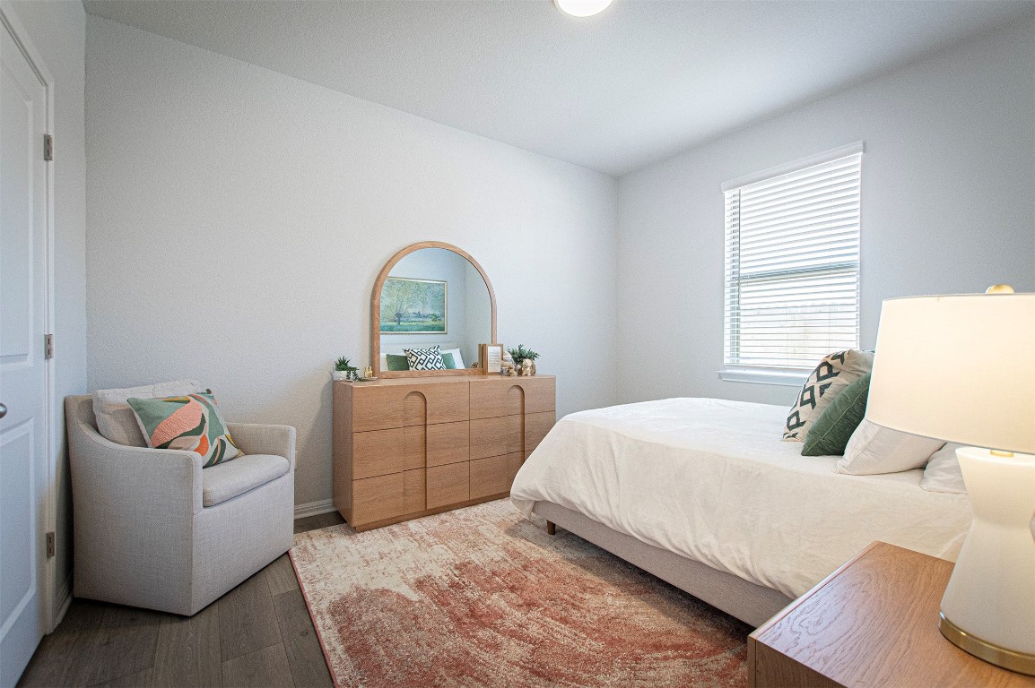 249 Treadwell Lane Kyle, TX 78640 - Photo 24 of 32 a bedroom with a bed and a couch