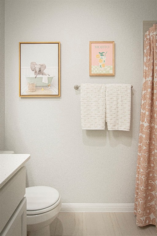 249 Treadwell Lane Kyle, TX 78640 - Photo 28 of 32 a white toilet sitting next to a white wall