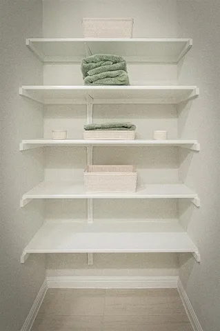 a view of a closet with shelf