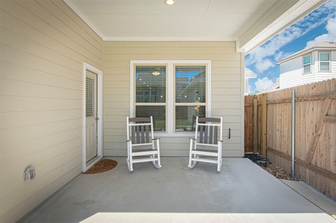 249 Treadwell Lane Kyle, TX 78640 - Photo 30 of 32 a view of chairs and door in a room