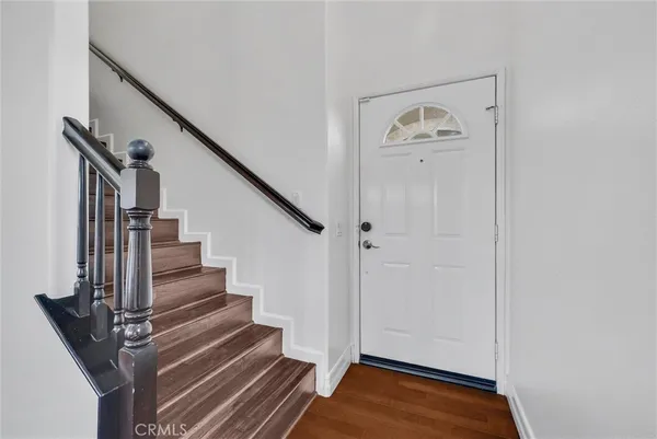 a view of entryway with wooden floor