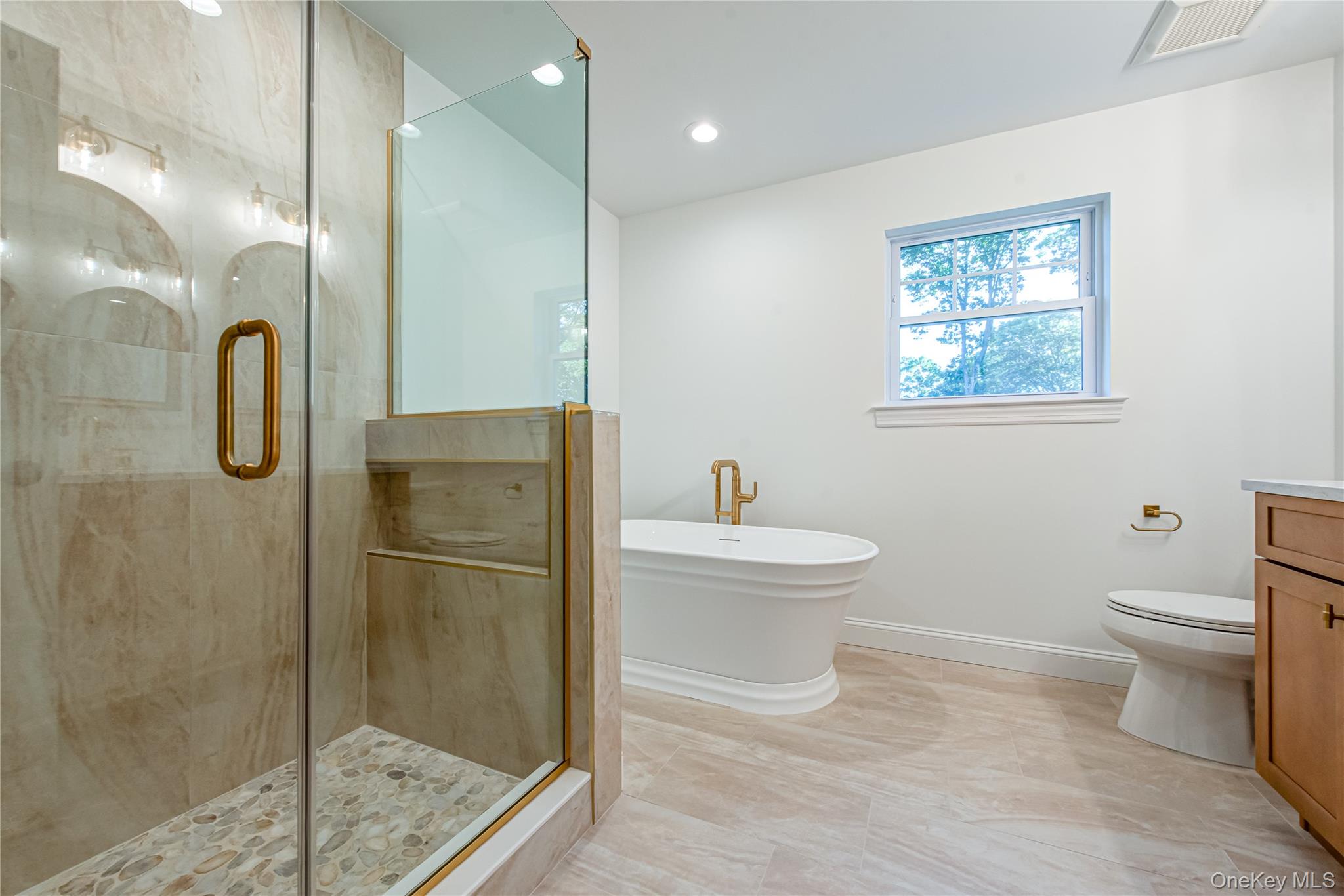 64 Blydenburgh Road Centereach, NY 11720 - Photo 36 of 44 Bathroom with a stall shower, a soaking tub, vanity, and recessed lighting. For Marketing Purposes!