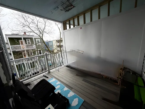 a view of balcony with wooden floor