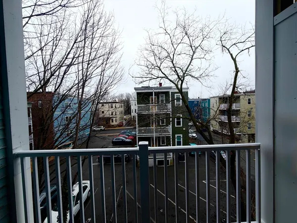 a view of a house with wooden fence
