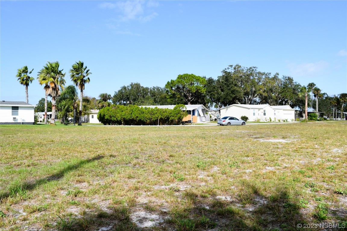 4366 Whiting Way Edgewater, FL 32141 - Photo 2 of 11 a view of a swimming pool with an outdoor space and seating area