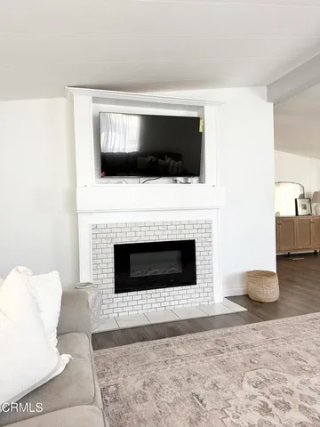 a bedroom with a bed and a mirror