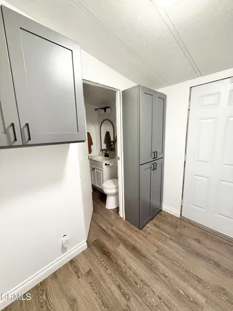 a view of a storage & utility room with wooden floor