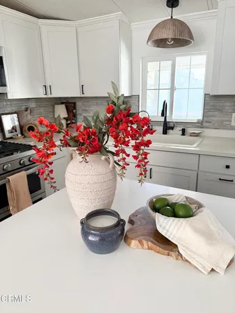 a view of living room with furniture and white wall