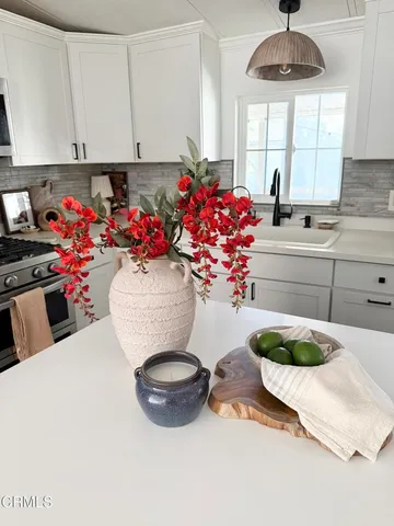 a view of living room with furniture and white wall
