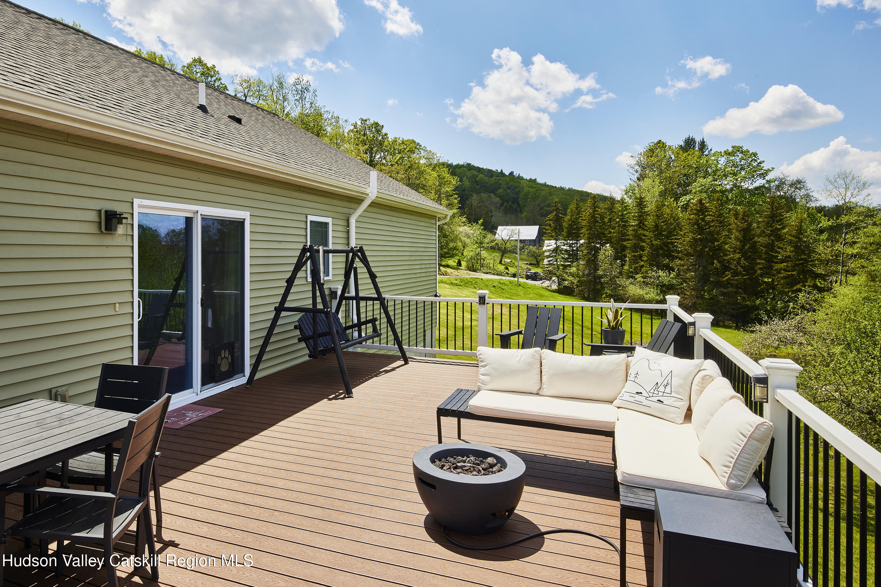 55 Hunter Road Parksville, NY 12768 - Photo 23 of 35 a view of a patio with couches table and chairs and potted plants