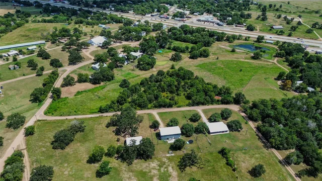 an aerial view of house with yard