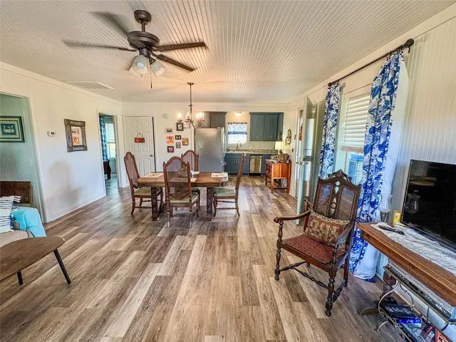 a kitchen with granite countertop cabinets stainless steel appliances and a sink