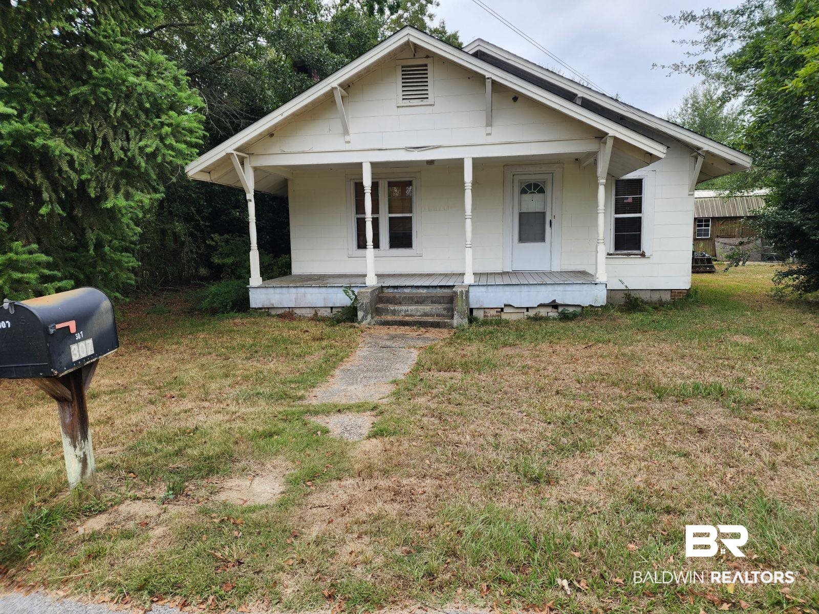 307 Scott Street Brewton, AL 36426 - Photo 17 of 19 Bungalow featuring a front yard and covered porch