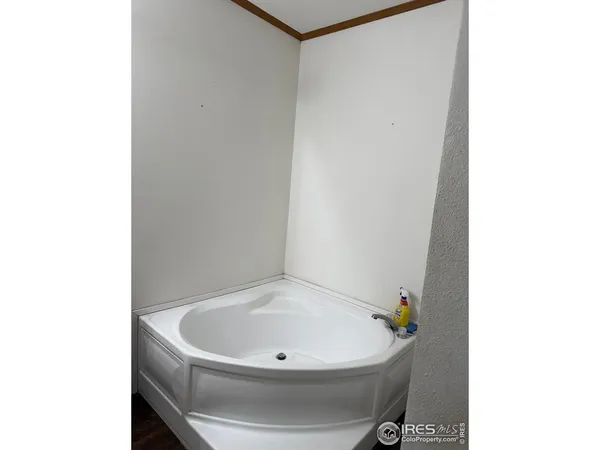 a white bath tub sitting in a bathroom