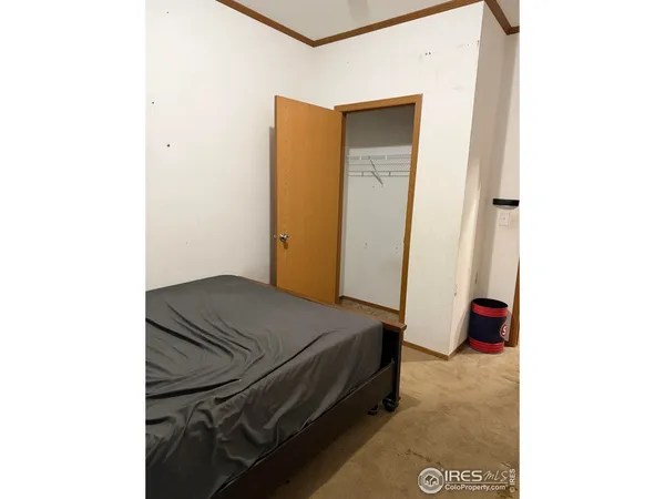 a bedroom with a bed and a cabinets