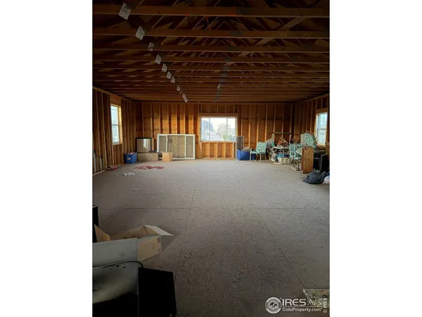 a view of a hallway with seating space