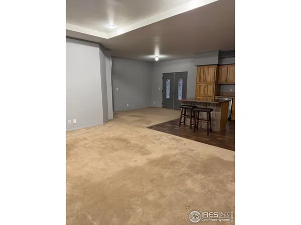 a view of a hallway with seating area