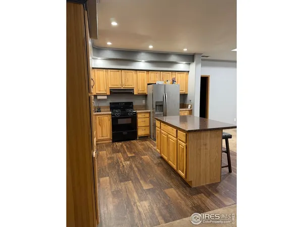 a view of a kitchen from the hallway