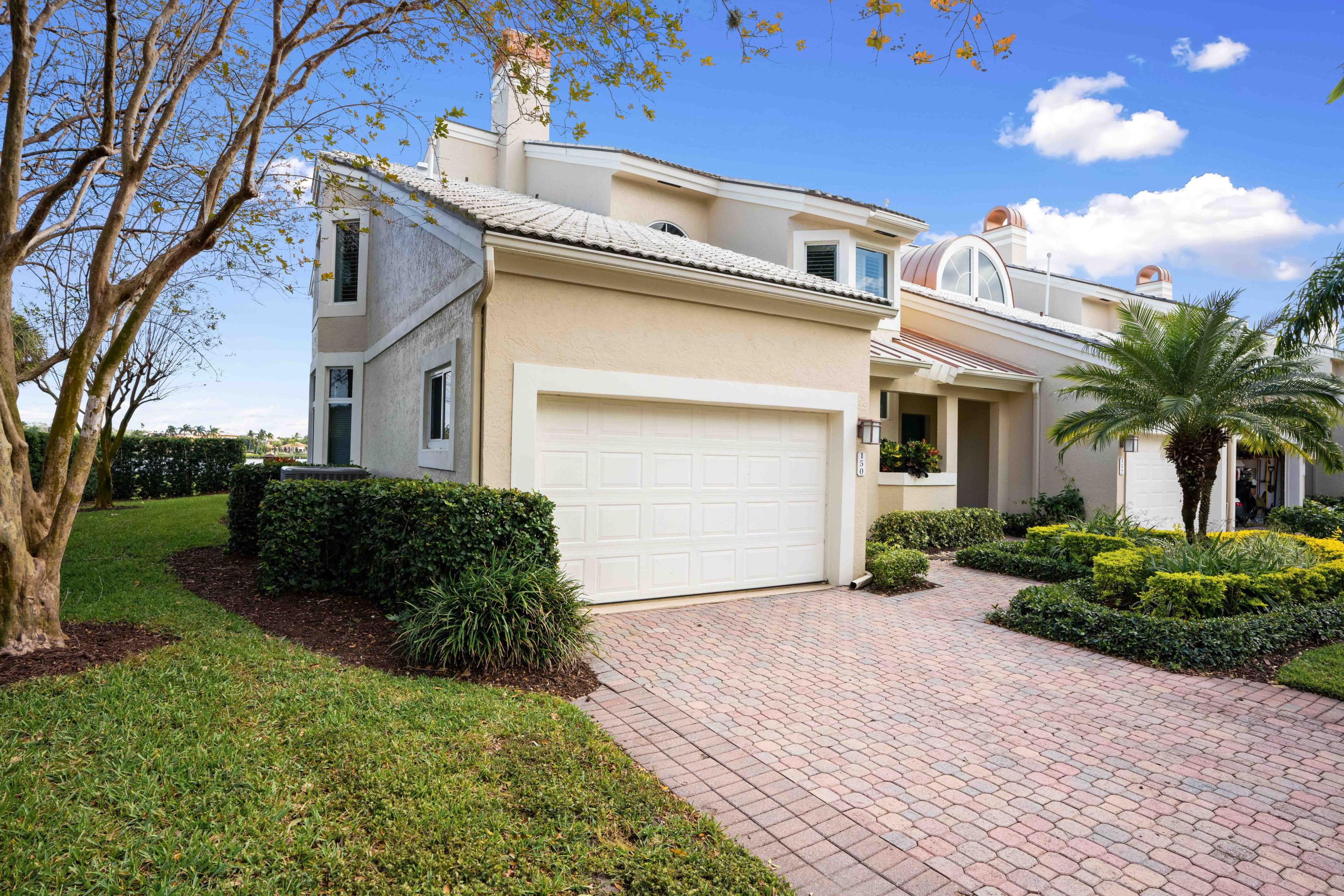 150 Eagle Drive Jupiter, FL 33477 - Photo 3 of 41 Front