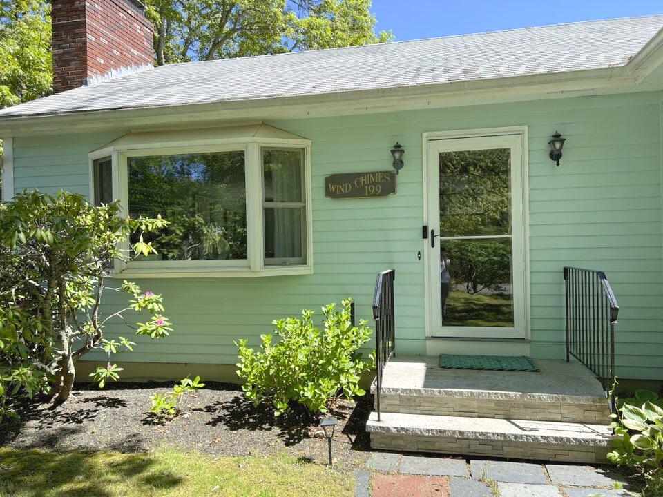 199 Timberlane Drive Brewster, MA 02631 - Photo 2 of 44 a front view of a house